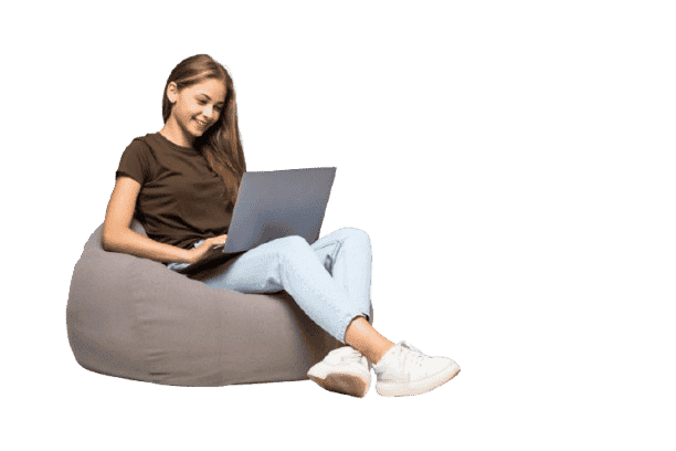young girl sitting in sofa and using laptop